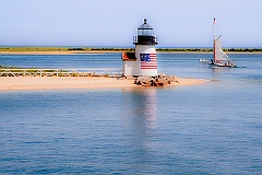 Sailing Past Lighthouse on Nantucket Island on a Summer Day